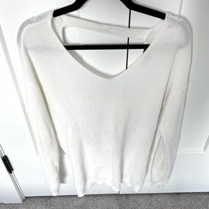 White sweater with tie knot in back